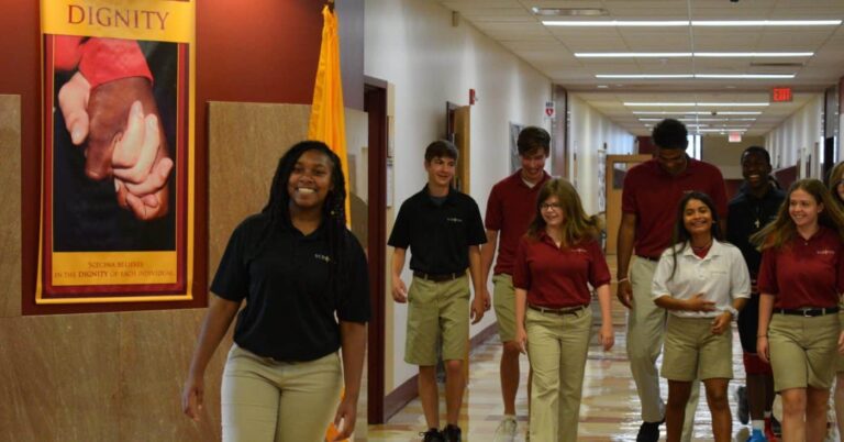 Scecina students walk down hallway