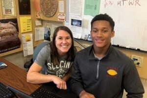 Scecina teacher Amy Fix poses with a student