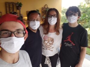 Lorenzo Bender pictured with his family, wearing masks
