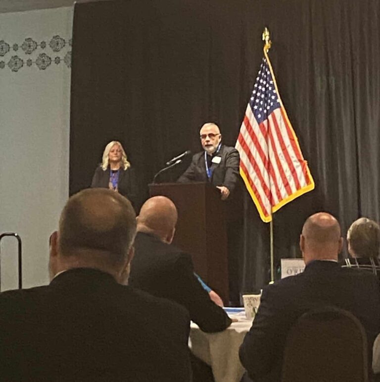 Father Joseph Moriarty at the podium